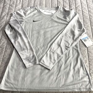Woman’s light grey/silver Nike athletic long sleeve shirt size Medium